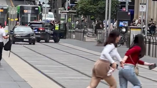 Pedestrians flee as a car drove erratically down Bourke Street Mall on Thursday evening. 
