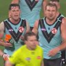 Zak Butters and other Port Adelaide players clash with the umpire on Sunday night.