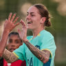 Sharn Freier celebrates with Mary Fowler after scoring Australia’s goal against Canada.