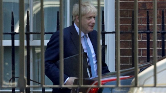 Boris Johnson leaves from the rear of 10 Downing Street on Thursday, on his way to the House of Commons.