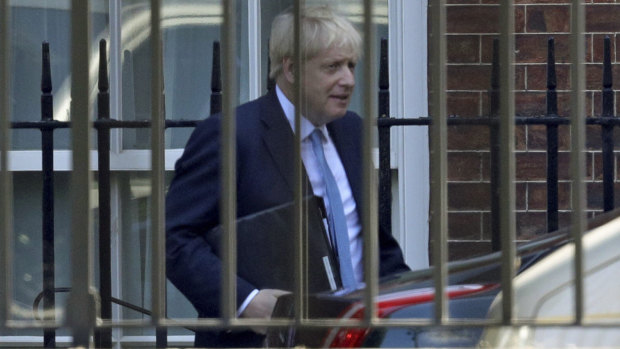 Boris Johnson leaves from the rear of 10 Downing Street on Thursday, on his way to the House of Commons.