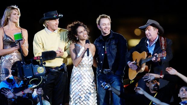 Mixed bag: Elle Macpherson, Greg Norman, Christine Anu, Savage Garden's Darren Hayes and Slim Dusty at the closing ceremony.
