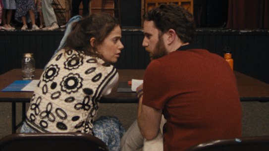 Molly Gordon and Ben Platt in Theater Camp play producers at a struggling theatre summer camp.