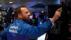 A trader works on the floor of the New York Stock Exchange.