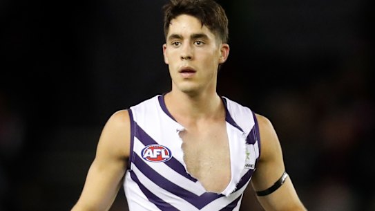 Docker Adam Cerra’s jumper is ripped in the physical clash with the Bombers.