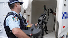 A South Sydney police officer seizes an e-bike during a recent operation.