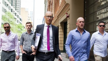 Shane Housego, Christian McDonald, Chris Sheehy and Steven Rapisarda with lawyer Nicholas Stewart (centre). Police have spent nearly $1 million defending their discrimination and freedom of information cases. 