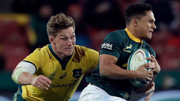 Strong chase: Australian captain Michael Hooper challenges Herschel Jantjies at Ellis Park in Johannesburg.