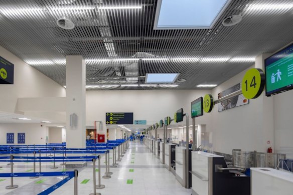 Modern check-in area at Mykonos International Airport.