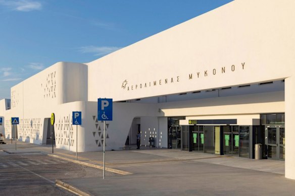 The Cycladic-style white-rendered exterior of the Mykonos International Airport.