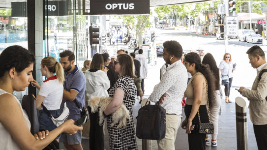 Lines outside the Optus store in Melbourne’s Bourke Street Mall on Wedneday.