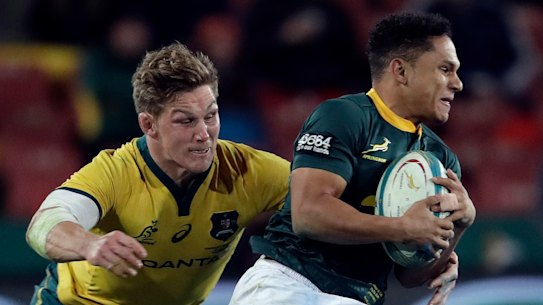 Strong chase: Australian captain Michael Hooper challenges Herschel Jantjies at Ellis Park in Johannesburg.