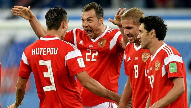 Ecstacy: Artem Dzyuba and teammates celebrate after a goal. 