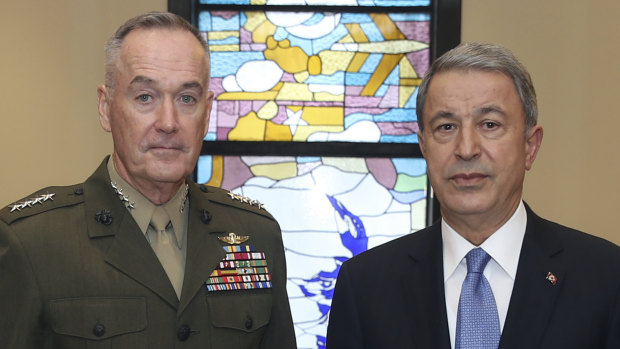 The US chairman of the Joint Chiefs of Staff, General Joseph Dunford, left, and Turkey's Defence Minister Hulusi Akar seen before a meeting, in Ankara, Turkey, on January 8.