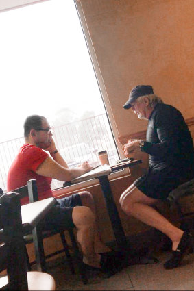 Casey councillor Sam Aziz (L) and developer John Woodman (R) meet at a Subway restaurant in April 2018. 