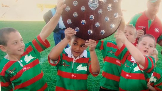 Keaon Koloamatangi lifts the Tommy Bishop Shield in 2005 with Cameron Murray (left).