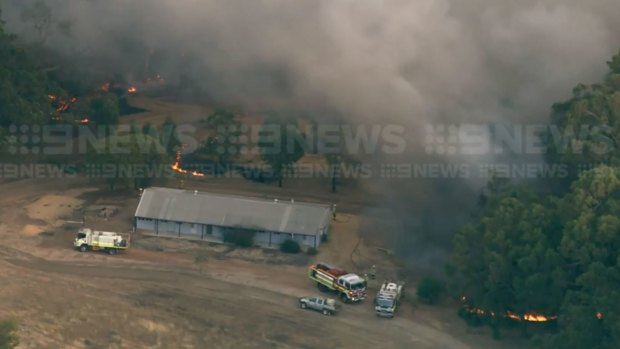 A fire burning close to a shed in Toodyay.