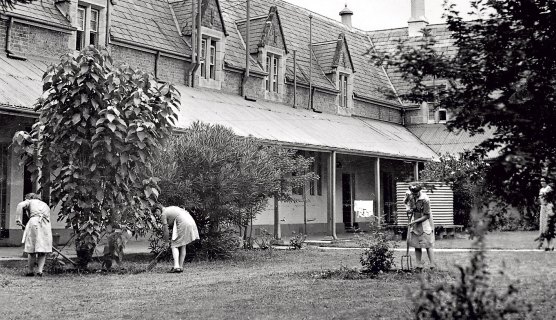 Girls work in the grounds of Parramatta Girls Home.