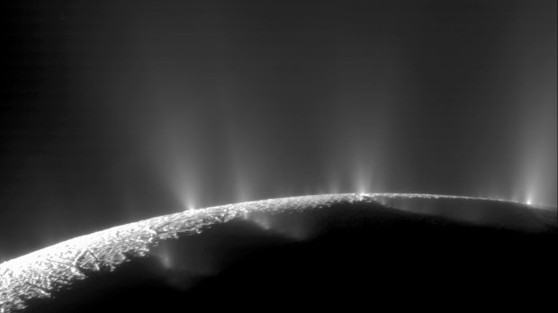 Plumes of water ice and vapour from the south polar region of Saturn's moon Enceladus, photographed by NASA's Cassini spacecraft in 2005.