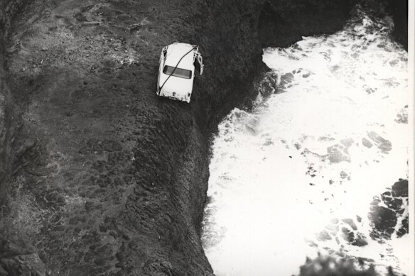 The Crawford family’s car teeters on a ledge above the water 16 metres down the walls of the Loch Ard blowhole.