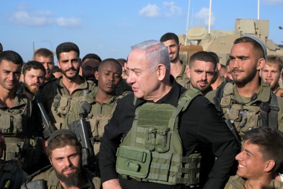 Israeli Prime Minister Benjamin Netanyahu meets with soldiers stationed near the Gaza Strip in Jerusalem.