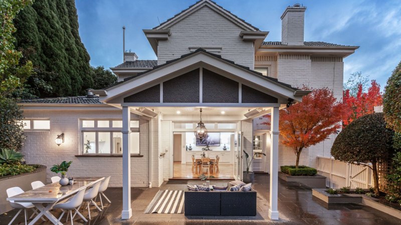 Young family snaps up $4.7 million Kew home in crowded auction