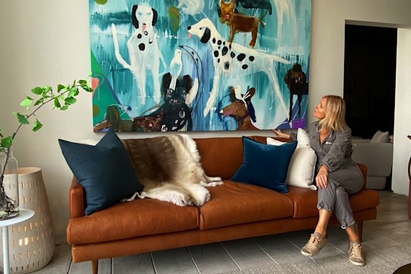 Melbourne-based artist Jessie Breakwell with a painting she did of the Osbourne’s dogs. 