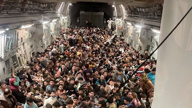 Afghans packed inside a US Air Force C-17 Globemaster III at Kabul airport on Sunday night.