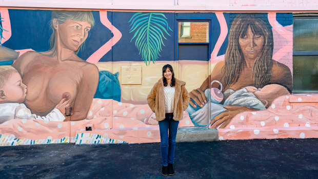 Artist Caroline Lejeune in front of her mural, “Breastralia”, in Collingwood.
