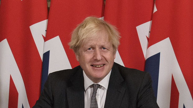 Victory: British Prime Minister Boris Johnson signs the UK-EU Brexit trade deal on Wednesday. 