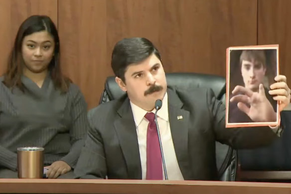 Richard Trumka jnr, a commissioner with the Consumer Product Safety Commission, holds up the photo of an amputee’s hand at a hearing.