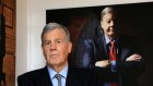 Big picture view: Seven consultant David Leckie in front of his portrait at Macchiavelli Restaurant in 2014.