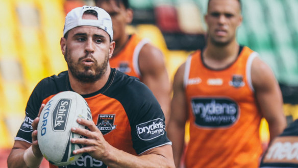 In the running: Josh Reynolds has some experienced competition for the five-eight role at the Tigers.