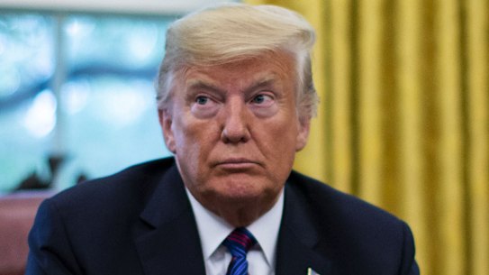 Trump bows to pressure, lowers flags again to honour John McCain