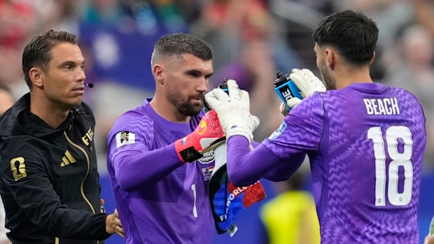 Mat Ryan (centre) replaced Patrick Beach ahead of the penalty shootout.