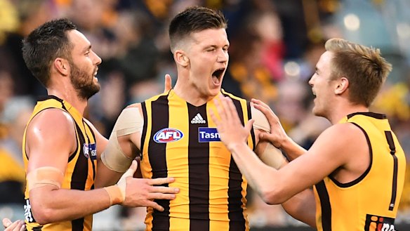 Happy Hawks: Mitch Lewis (centre) celebrates a goal during the round 8 clash against GWS at the MCG.
