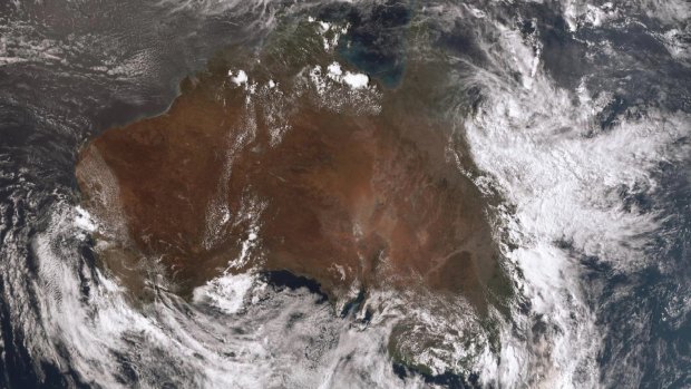 Heavy cloud covered much of Queensland's eastern coastline on Sunday as ex tropical cyclone Owen dumped record breaking rain on the state.