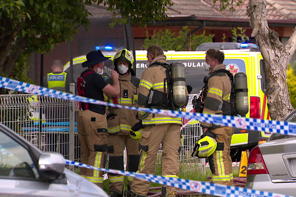 Firefighters outside the home on Monday.