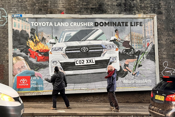 Activists defaced 400 billboards advertising BMW and Toyota across Europe.