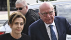 Rupert Murdoch, centre, and his wife Elena Zhukova Murdoch, arrive at the Reno courthouse.