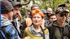 30 November 2025. Leader of the One Nation Party and Federal MP Pauline Hanson leaves the crowd, surrounded by security at the Put Australia First rally in the Flagstaff Gardens. Photograph by Chris Hopkins