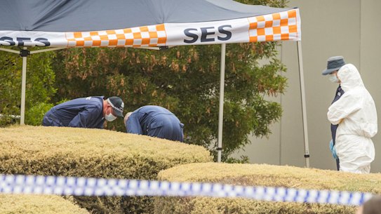 Investigators examine the woman's body found in Bundoora.