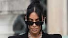 Kim Kardashian, accompanied by her mother Kris Jenner, leaves the justice palace after testifying.