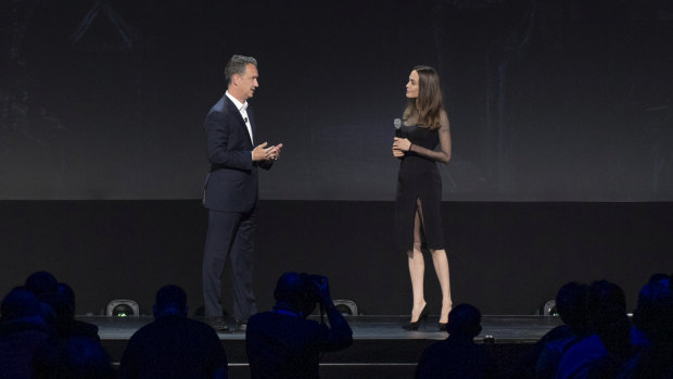Walt Disney Studios president Sean Bailey talks to Angelina Jolie on stage at D23.