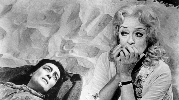 Bette Davis plays an ageing child star opposite her great screen rival, Joan Crawford, as her paraplegic sister, in the 1962 psychological horror thriller Whatever Happened to Baby Jane?