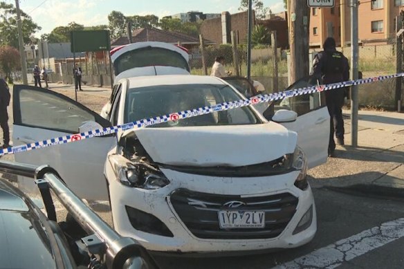 The white hatchback with Victorian number plates can be seen with a hole in its windscreen.