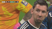 Lionel Messi stares at Jude Bellingham.