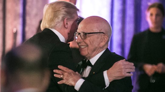 Rupert Murdoch and then US president Donald Trump embrace at a function in 2017.