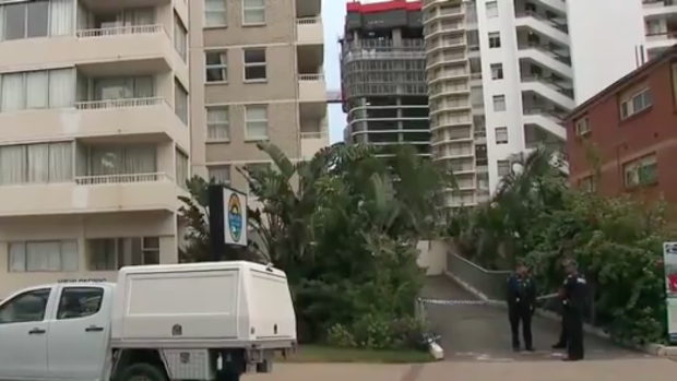 Police at the Gold Coast high-rise after the teenager's fatal fall.