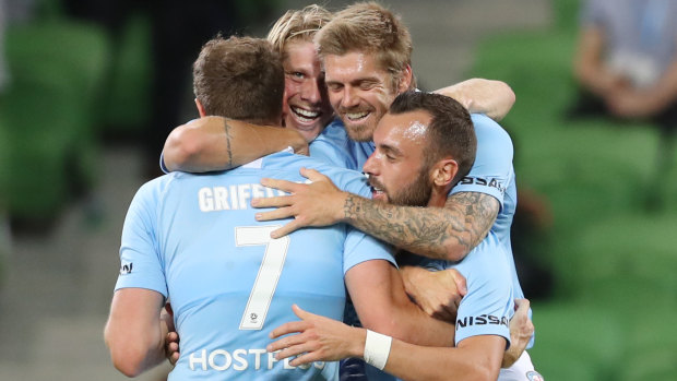 Net result: Melbourne players celebrate after Rostyn Griffiths scores a goal at AAMI Park last night. 